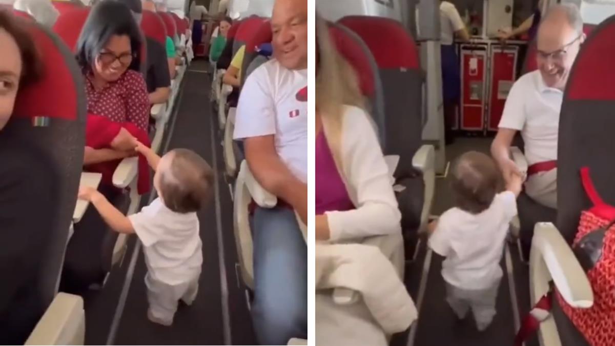 Αξιολάτρευτη μικρούλα χαιρετά όλους τους συνεπιβάτες της στο αεροπλάνο!